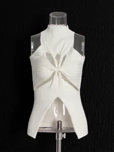 White sleeveless knit top with high neck and front cutout twist design