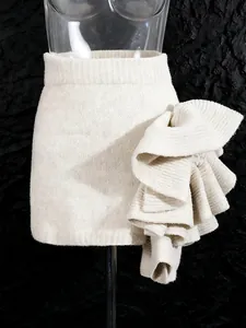 Elegant off-white knit mini skirt with oversized 3D ruffle flower detail