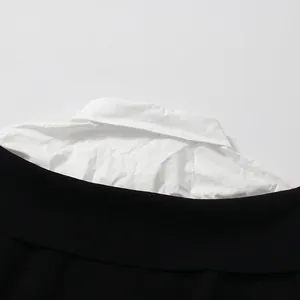 Close-up of contrast collar detail on fake two-piece patchwork knitwear top for women