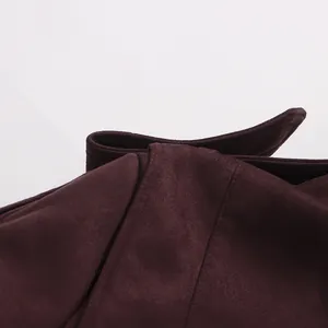 Close-up detail of burgundy suede-like jacket fabric with premium stitching on lapel