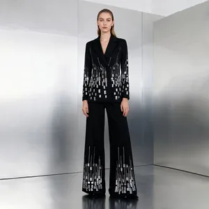 Detailed view of a black blazer suit set with silver sequin geometric patterns.