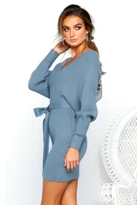 Detail view of a blue V-neck ribbed knit dress with a stylish tie waist and slim fit.