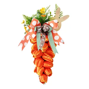 Easter carrot wreath made of orange artificial tulips decorated with wooden bunny and ribbons