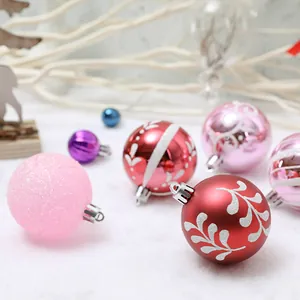 Set de 24 bolas de Navidad de 6cm pintadas a mano en varios tonos rosa y rojo