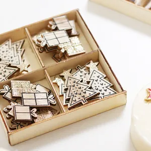 Set of wooden Christmas tree and gift box ornaments in a wooden storage tray