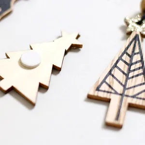 Set of minimalist wooden Christmas tree wall stickers featuring natural wood grain finish