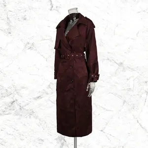 Elegant long burgundy faux suede trench coat featuring a lapel collar and grommet belt.