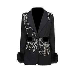 Elegant black blazer with rhinestone embellishments, waist cut-outs and faux fur cuffs.