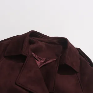 Detail of burgundy faux suede coat collar with notched lapel and smooth lining