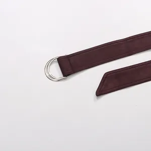 Detail view of the burgundy suede waist tie with silver D-ring buckle on French style jacket