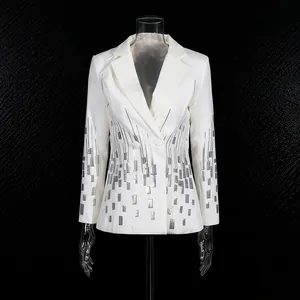 Front view detail of white blazer with silver sequin pattern and lapel on black background.