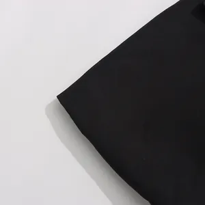 Macro detail of high-quality black suit fabric texture for premium women's blazer jacket