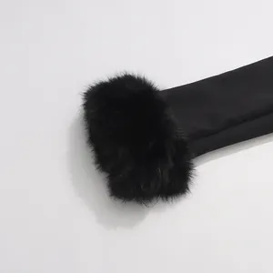 Detailed macro view of the fluffy black faux fur cuff on a elegant luxury blazer jacket