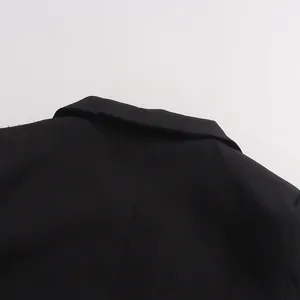 Back collar detail showing the premium fabric and clean stitching of a black luxury blazer
