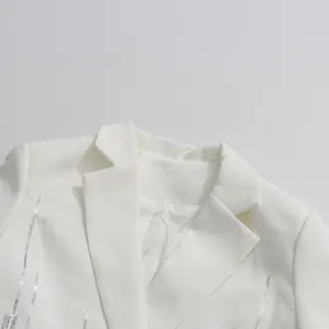 Detailed close-up view of elegant white French-style lapel blazer with silver sequin stripes