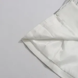Close-up showing the high-quality interior lining and stitching of the white sequin suit.