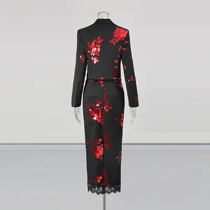 Back view of elegant black two-piece set with red floral sequins and lace hem detail.