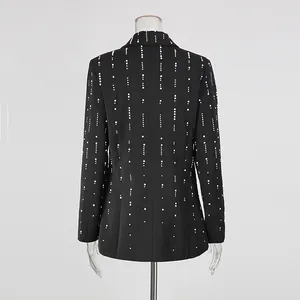Detail view of black blazer back featuring elegant vertical pearl stripe embellishments