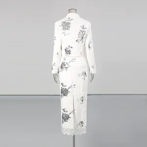 Detailed back view of elegant white sequin jacket and lace patchwork skirt two-piece set