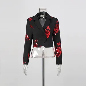 Detail view of a stylish black cropped blazer with vibrant red sequin floral embroidery