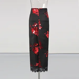 Rear view detail of high-waist black skirt with red floral sequins and lace trim
