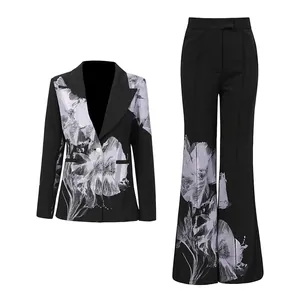 Black two-piece suit set featuring asymmetric floral print blazer and flared pants