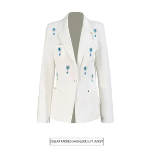 Front view of white padded shoulder suit jacket with blue rhinestone embellishments.