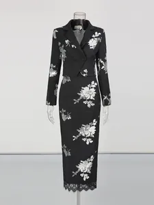 Elegant black sequin floral two-piece set with cropped blazer and lace midi skirt.