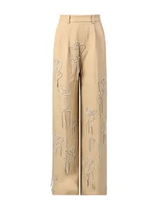 Pantaloni a gamba larga kaki a vita alta con eleganti motivi di figure in strass