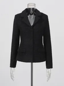 Elegant black tweed jacket featuring notched lapel and waist pockets for a classic look