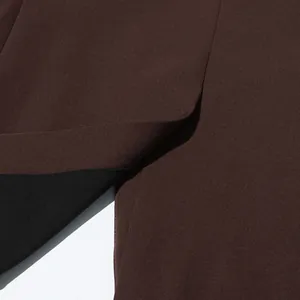 Close-up of the irregular overlapping design and texture of a brown British style blazer