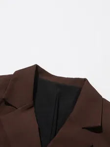 Close-up view of a brown British style suit jacket collar with sharp lapels