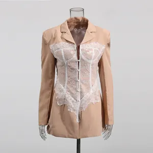 Detailed view of a nude blazer featuring intricate white lace corset overlay and boned waist.
