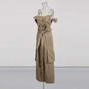 Side detail view of an elegant khaki strapless wide-leg jumpsuit with waist belt