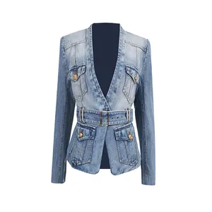 Detail of a chic fitted distressed denim blazer featuring gold buttons and a matching waist belt