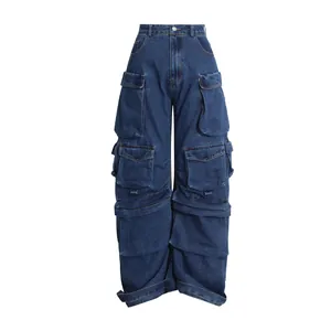 Detail view of dark blue wide-leg cargo jeans with stacked multi-pocket design