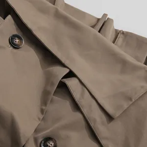 Detailed close-up showing the high-quality khaki fabric and marble-effect buttons