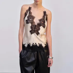 Detailed view of elegant French style V-neck silk camisole with black lace trim