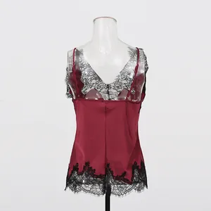 Detailed back view of a burgundy silk-like camisole featuring delicate black lace patchwork trim