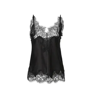 Detail shot of elegant black silk camisole with delicate floral lace trim