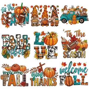 Detailed view of fall-themed heat transfer stickers with gnomes and pumpkins.