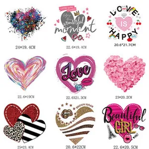 Detail view of nine assorted heart-shaped heat transfer patches with specific dimensions