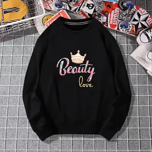 Stylish black crewneck sweatshirt featuring a crown and Beauty Love floral graphic print