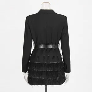 Back view of black blazer dress with elegant ostrich feather fringe detailing.