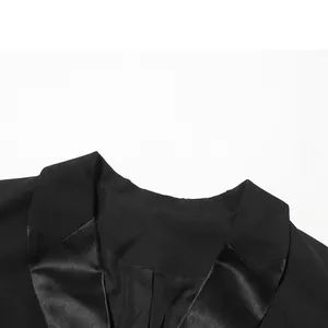 Close-up detail showing the elegant satin notched lapel of this black blazer dress