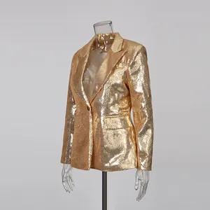 Detailed view of a glittering gold sequined blazer displayed on a clear mannequin