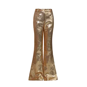 Detailed view of high-waisted flare trousers with shimmering gold sequins and elegant cut
