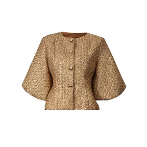 Detailed front view of elegant gold tweed jacket with puff sleeves and decorative buttons