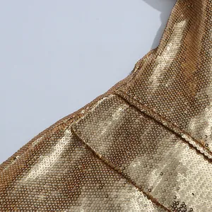 Close-up of gold sequin blazer showing detailed texture and seam craftsmanship