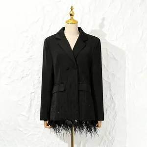 Detailed front view of black blazer with ostrich feather and shell patchwork.